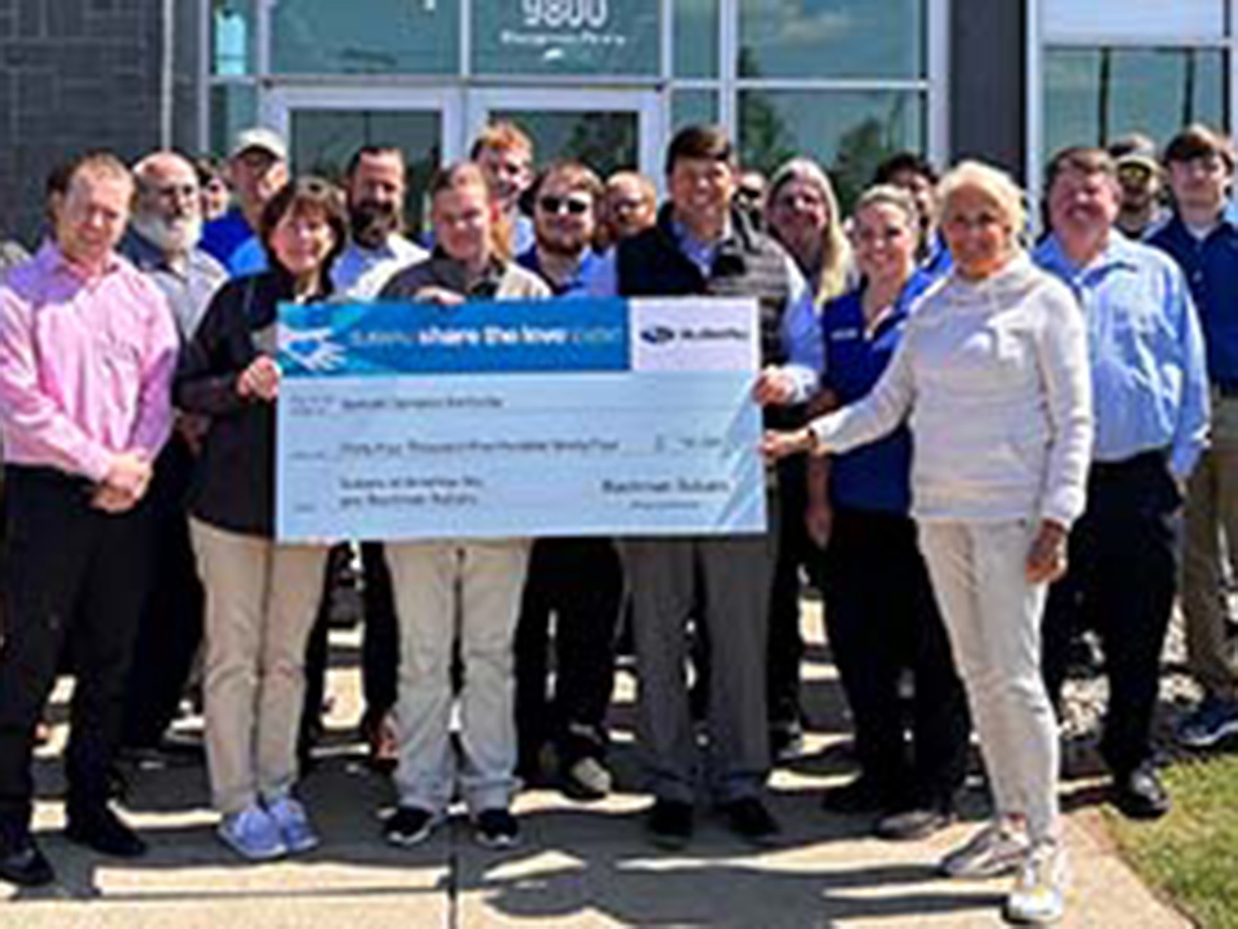 Bachman Subaru team presenting the 2022 Share the Love check to Special Olympics athletes and CEO.