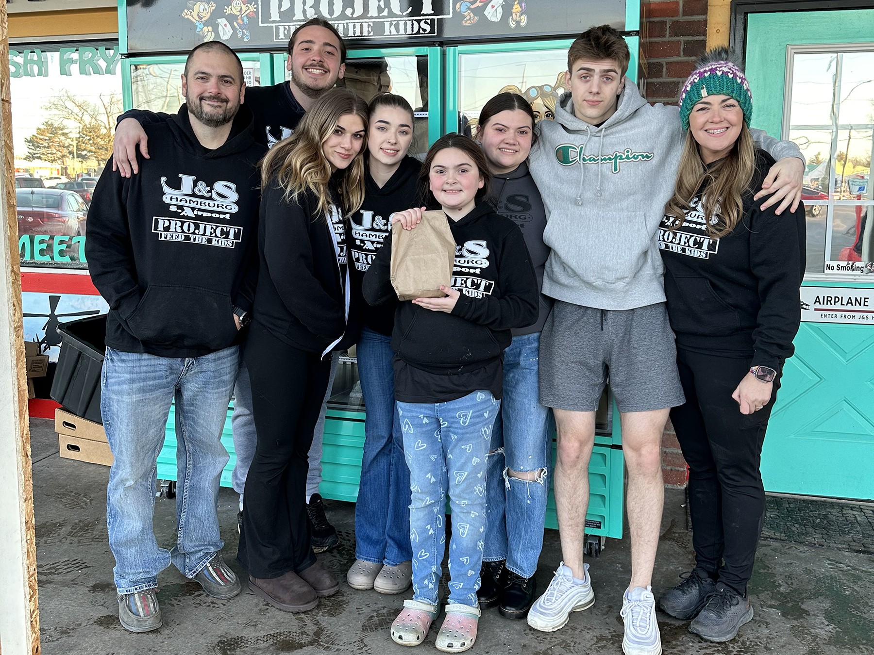 This photo is our family after packing 2,500 meals for the week. Our family needed a lot of help when our kids were younger; now our children pack meals for those in need. We, together as a family with the help of volunteers, fight food insecurities.