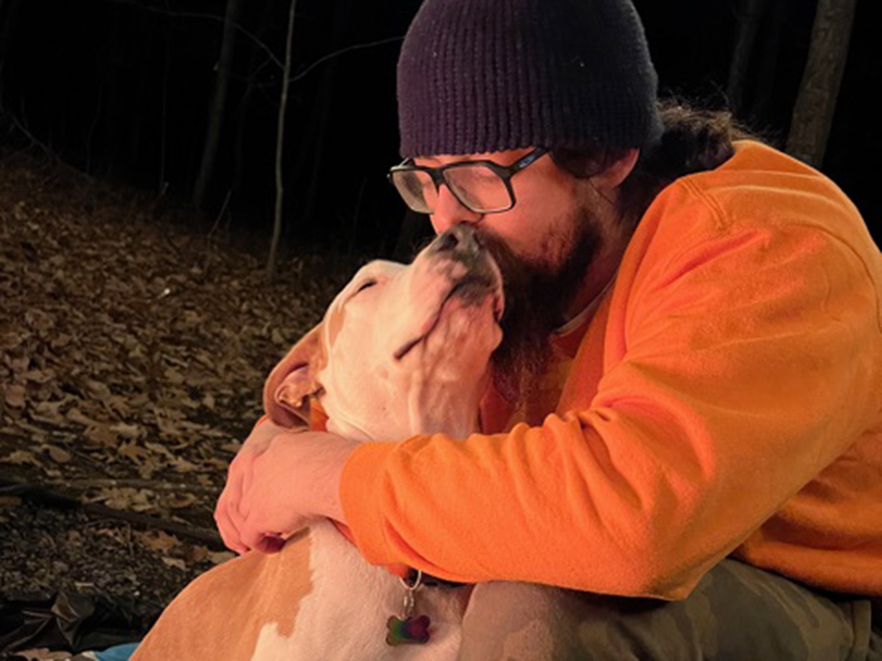 Dylan hugs his dog, Peanut, who was awarded a grant through our Companions in Crisis program to help treat a chondrosarcoma bone tumor that required surgery, radiation, and chemotherapy thanks to the support of Subaru's Share the Love campaign.