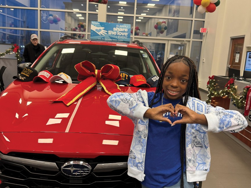 Wish Kid Chloe showing her appreciation and love for Quality Subaru who granted her wish to have a Cheer Cave! Chloe visited during the Share the Love Event to say thank you to staff and customers! Impact