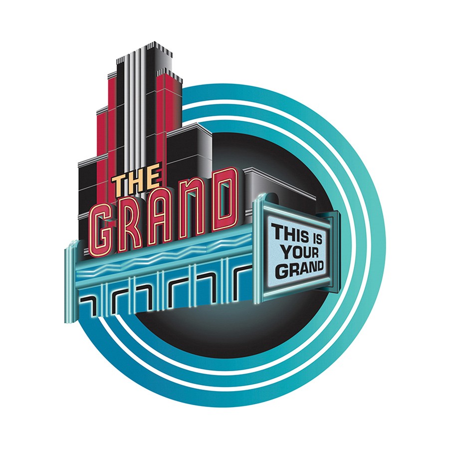 Share the Love check presentation before a concert at The Grand Auditorium.