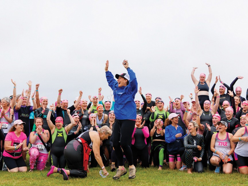 Tri for a Cure cancer survivors gathering together before the start of the event. Impact
