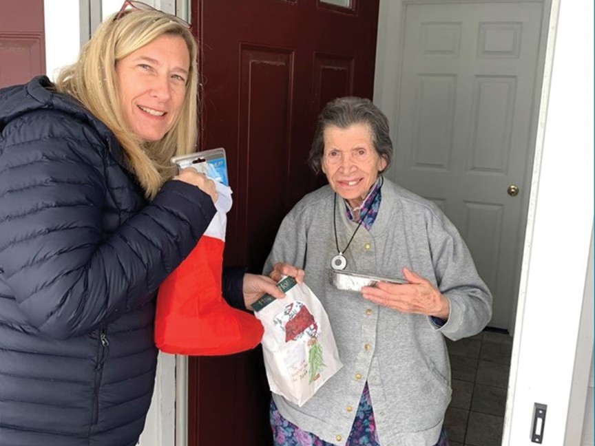 Simmons Rockwell Subaru employee delivers nutritious meals and a gift filled stocking to a 95 year-old homebound senior during the Subaru Share the Love Event. Impact
