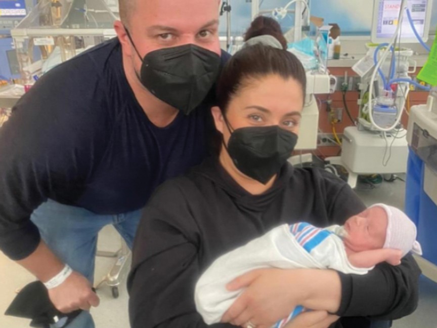 NICU parents with their baby. Impact