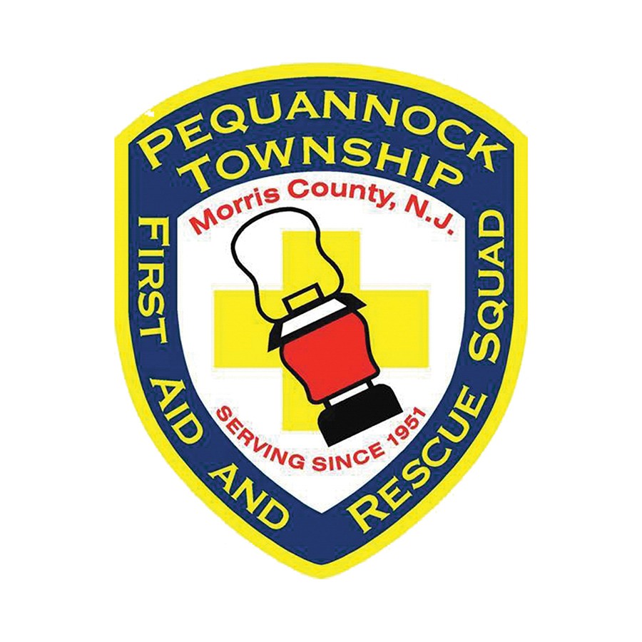 Members of the Pequannock Township First Aid & Rescue Squad displaying a check they received from Wayne Subaru through Share the Love.