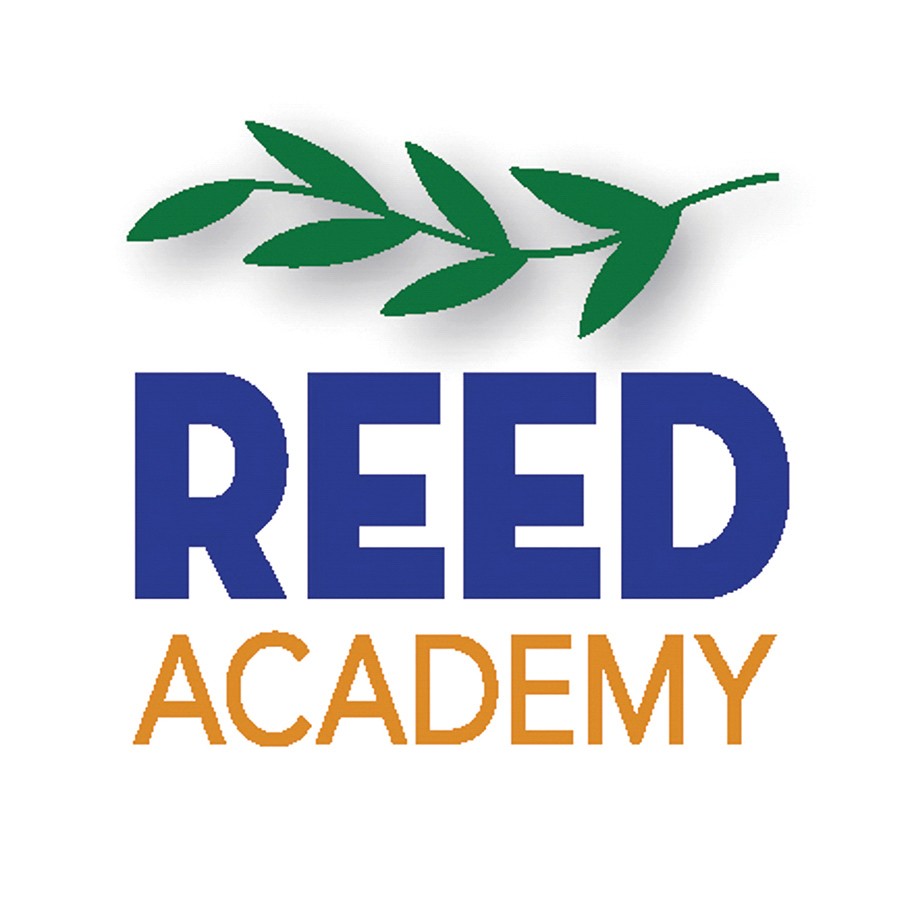 This is a photo of Subaru owners, Art and Beth Picciano, Subaru employees, and Reed CEO, Board Chair and Board members and Reed VP of Development being presented with the funds raised through Share the Love program.