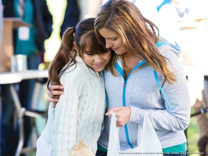 Matthews Auto picking up toys for children living at the YWCA. Impact