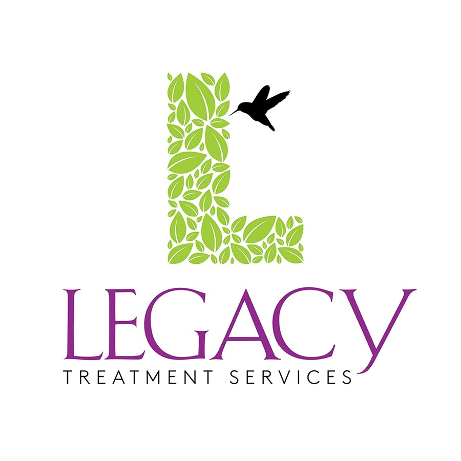 Legacy Director of Development Mark Hatoff and Legacy Foundation Executive Director Marla Meyers receive a check from Melissa Miller and the Miller Subaru dealership for Subaru Share the Love in 2024.