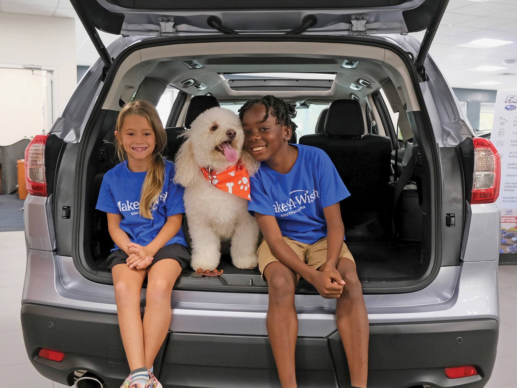 Wish Kids Cameron and Rhiannon participated in a photo shoot for the Share the Love Event. Cameron, age nine, who battles a blood disorder, wished for a puppy, meet Comet. Rhiannon, age eight, who has a rare disease, wished to go to Disney.