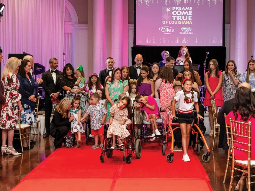 Dream kids participating in our fashion show. The adults you see among the kids are escorts; some kids need assistance, and some do not. Impact