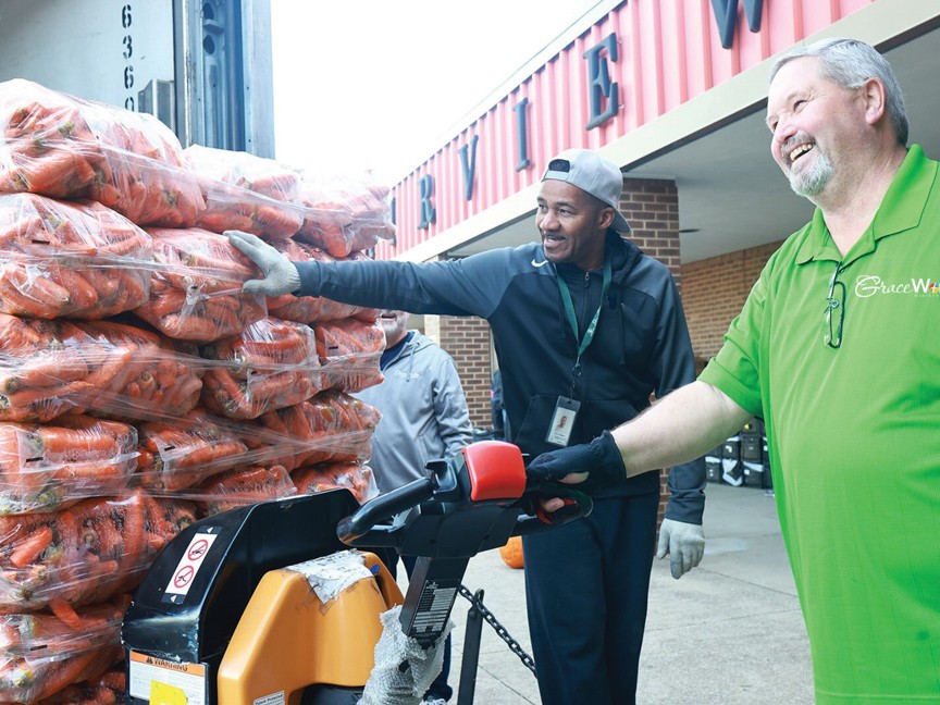 GraceWorks team members unload vegetables at our Mobile Food Pantry. Each of our food carts contains six essential ingredients: milk, eggs, butter, protein-rich meats, fruits, and vegetables—ensuring a healthy, well-balanced diet. Impact