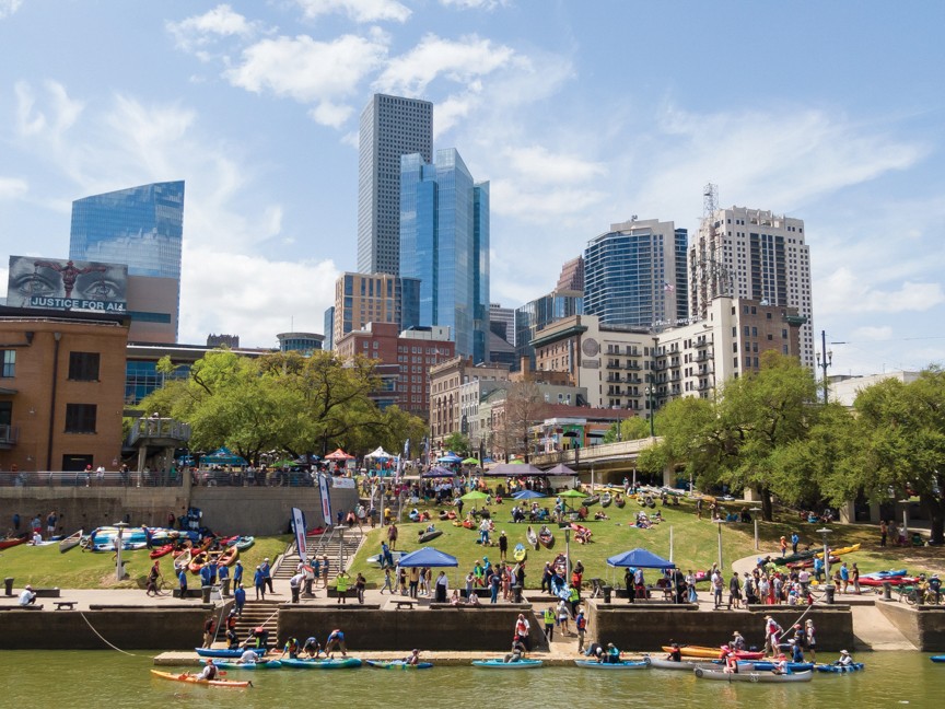 Kayakers and canoers disembark at Allen's Landing to finish their 15-mile race down Buffalo Bayou. They are met by finish-line festivities including lunch, music, and more. Impact