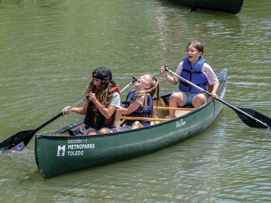 Children participating in nature camp, learning how to canoe while also learning about the environment and outdoor recreation. Impact