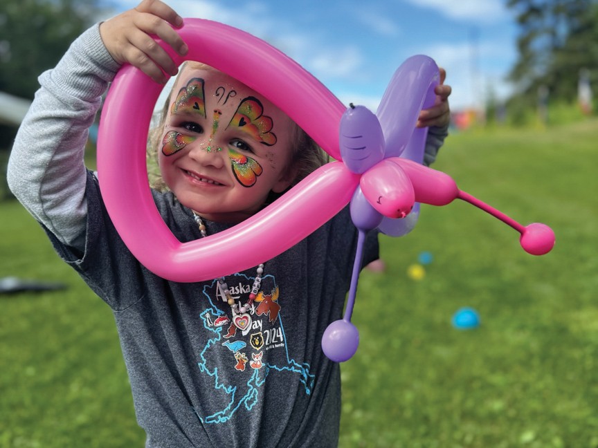 Ella participating in our Annual Alaska Flag Day celebration event. Impact