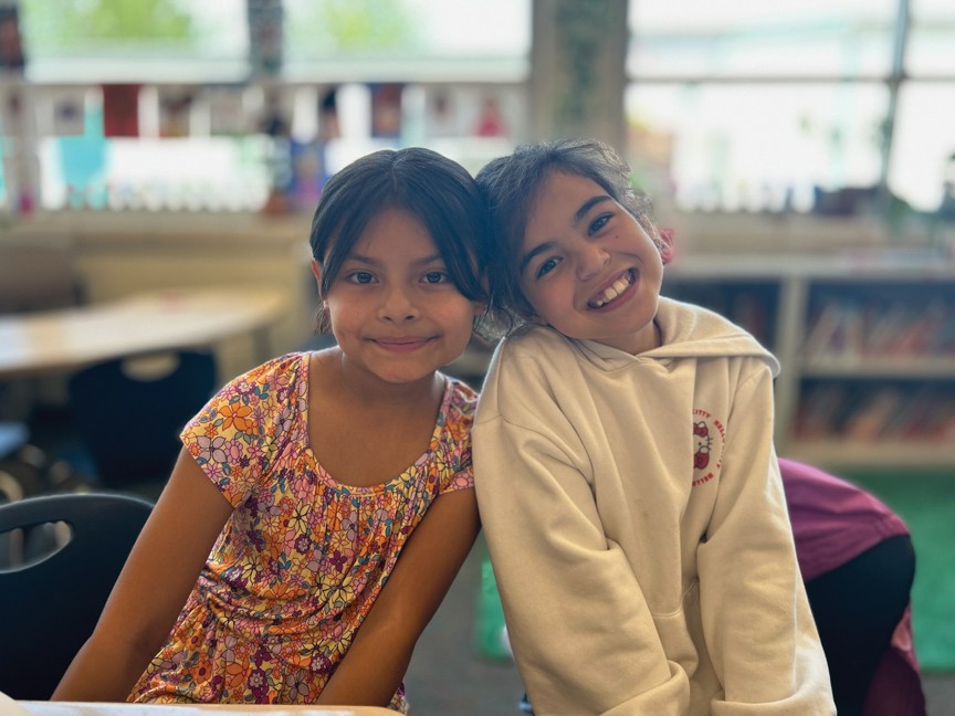 These two young ladies just finished a computer science study buddies' program and created Mother's Day cards out of paper circuits, a lesson led by Hazen High School's Teacher Academy and computer science. Impact