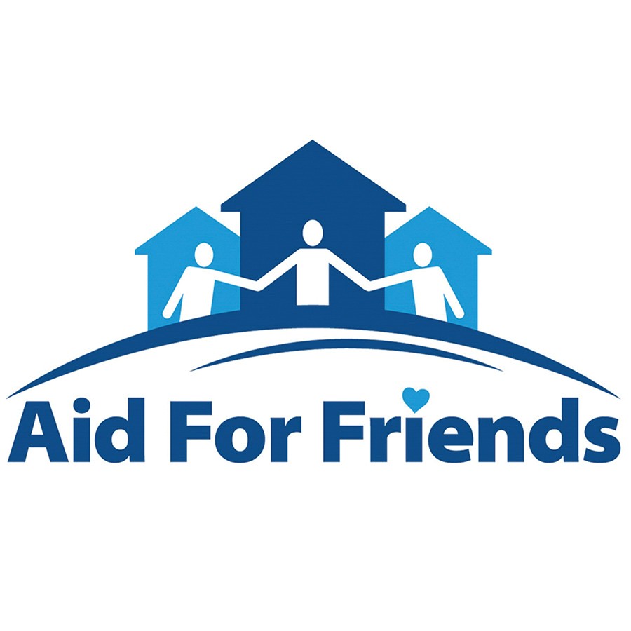 Subaru Share the Love check presentation to Aid For Friends from Phil Meador Subaru.