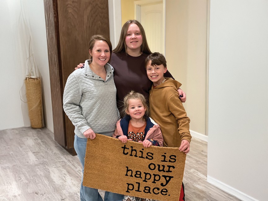 Homeownership Program Partner Savannah Schadegg and her family in their new home constructed by Habitat for Humanity, The Heart of Wyoming. Impact