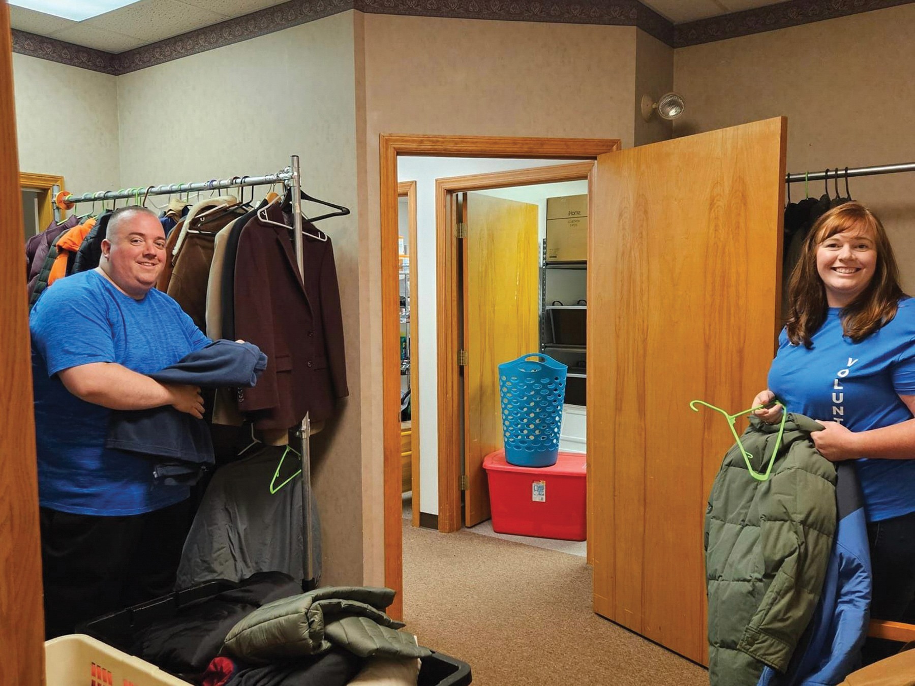 Executive Director, Dan Carney (left) and a volunteer prepare our coat donations for distribution to homeless men in Westmoreland County.