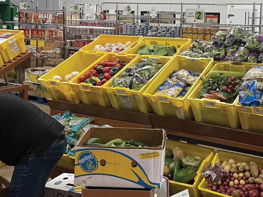 Volunteers are pitching in to help stock groceries so our neighbors can shop for the food their families need. Impact