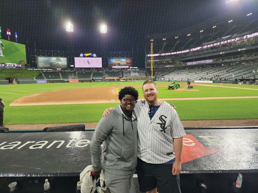 Malachi attending his very first Chicago Sox game with his mentor, Brendan. Brendan and Malachi have been matched for three years, and they enjoy doing CrossFit and outdoor activities together, which has helped Malachi's confidence and self-esteem. Impact