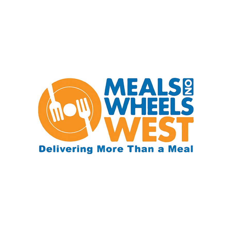 Chris Baca, Executive Director of Meals on Wheels West and team receives their Subaru Share the Love check from Subaru Santa Monica.