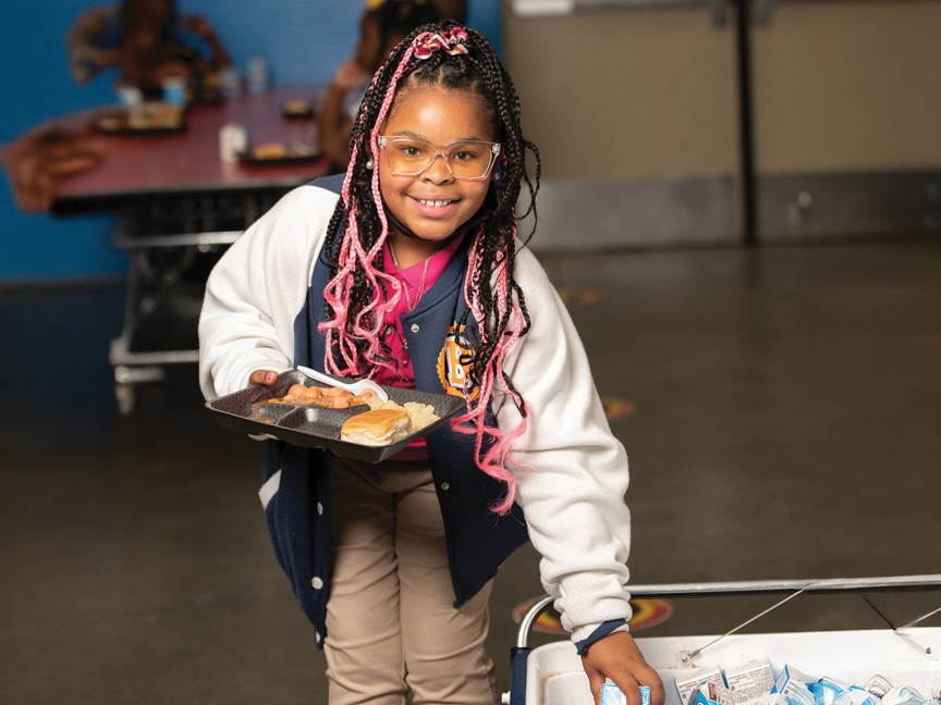 A Club Kid receiving a healthy and hearty meal at the Club. Impact