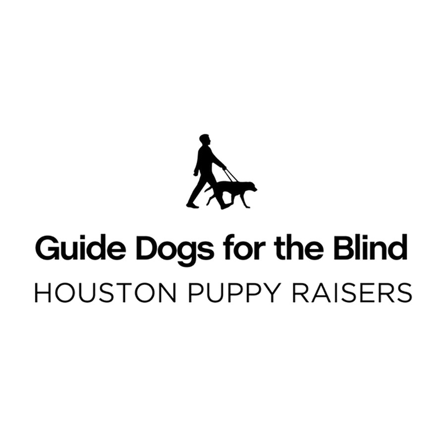 Employees from Superior Subaru of Houston and volunteers with Guide Dogs for the Blind and their puppies at the Share the Love check presentation.