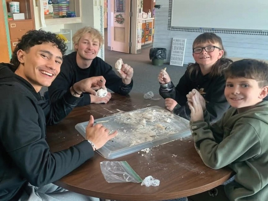 School-Based Mentoring matches bond while working on craft projects. These matches meet once a week at the Little's school and spend time together working on schoolwork, playing games, or creating crafts. Impact