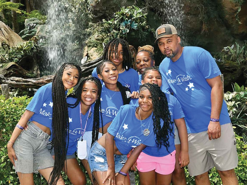 Wish Kid, Aeriyunna Smith, age 17, who had a liver transplant as a young child, is pictured at Disney World with her family. Impact