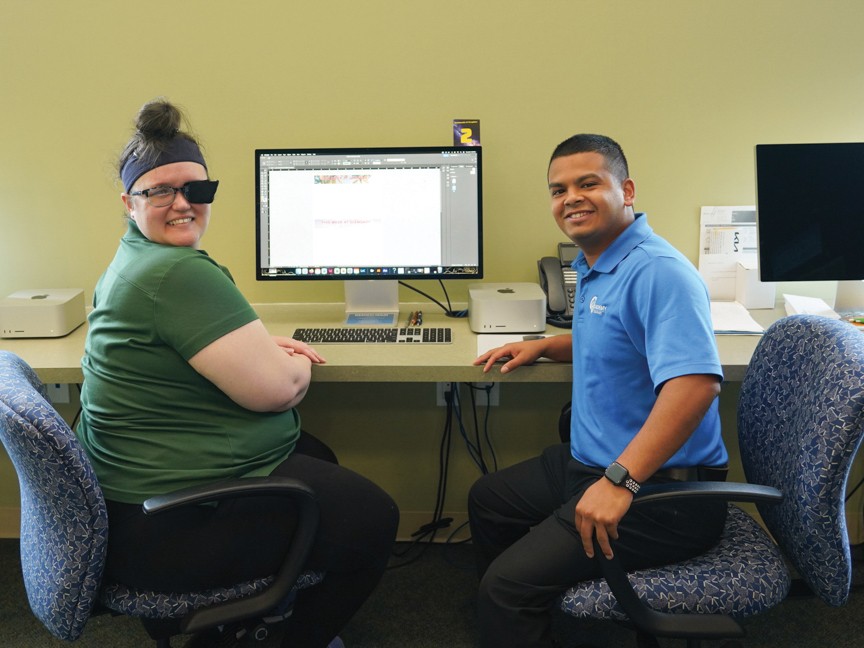 Support from Subaru Share the Love supports vocational training of adults living with mental illness. In this photo, Academy member Danica (left), is training in graphic design and multimedia. Impact