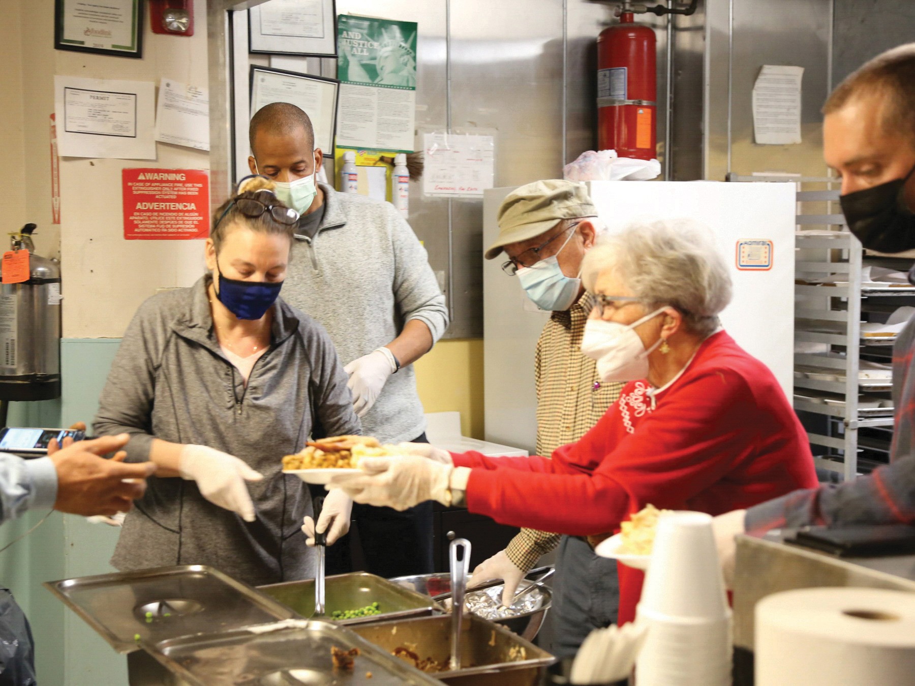 Serving Thanksgiving dinner at our shelter.