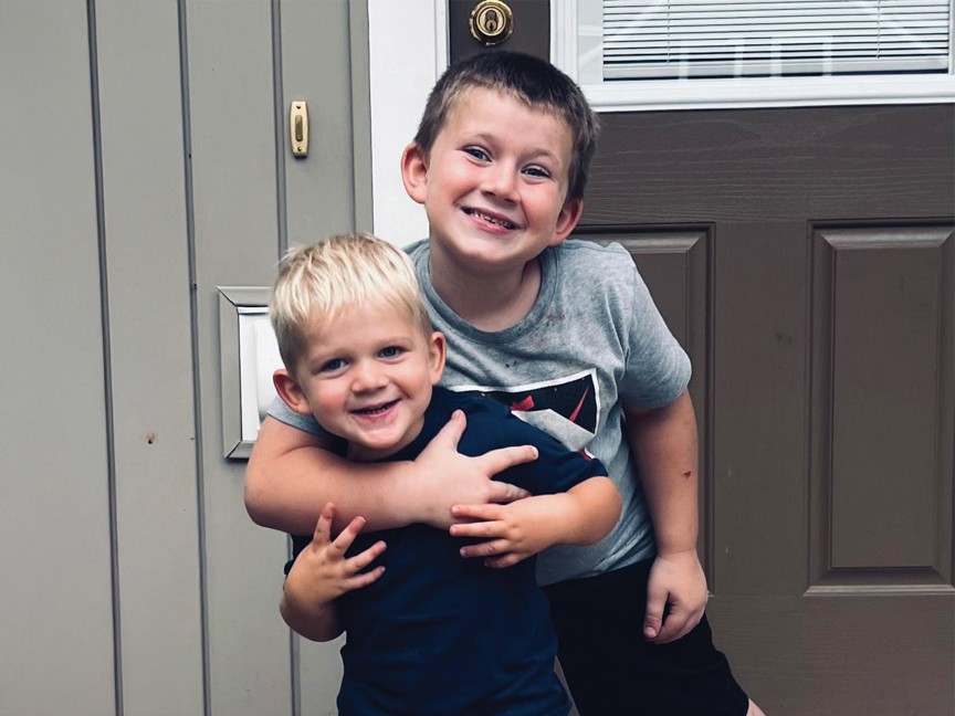 These two smiling boys are standing in front of the door to their new apartment. Their family transitioned out of our shelter program and into permanent housing. This photo captures the joy as they begin a new chapter in a place they now call home. Impact