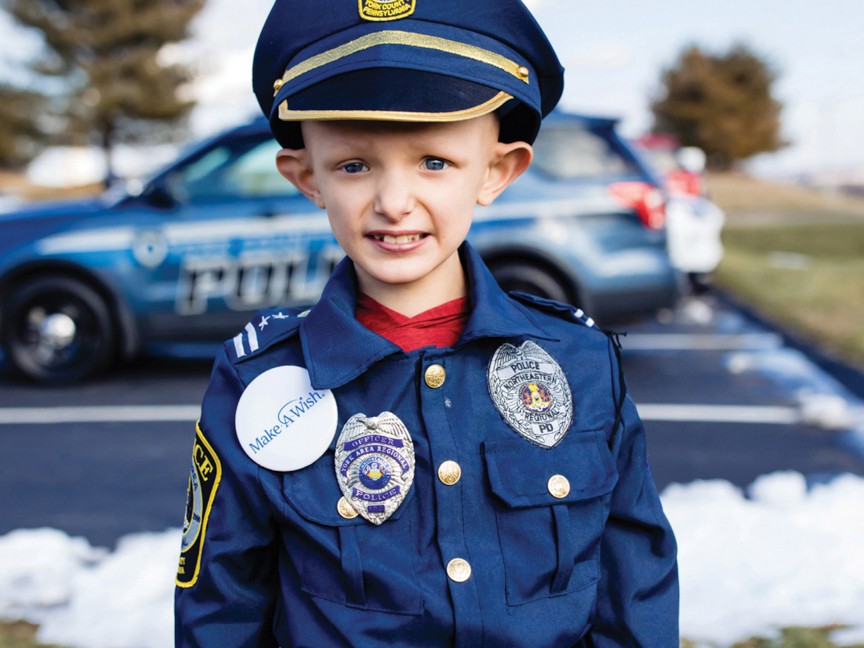 Landen, a little boy who was sworn in as a police officer for the day. This day was also special for us, because Landen's wish was our chapter's 20,000th granted! Impact
