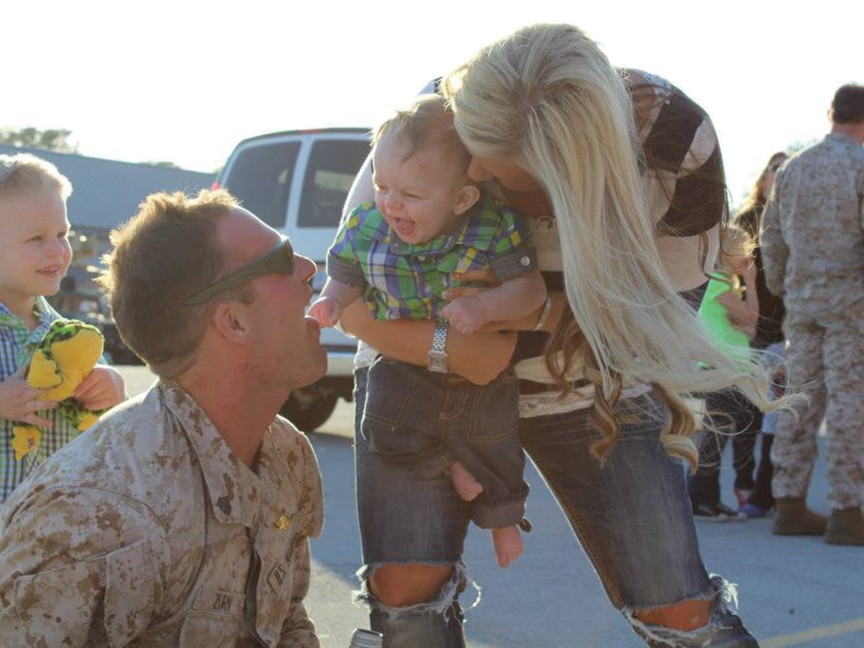 A service member embraces his daughter, symbolizing the strength of military families. The image reflects the shared commitment of Hope For The Warriors and Subaru to honor and support our military through strength, stability, and community. Impact