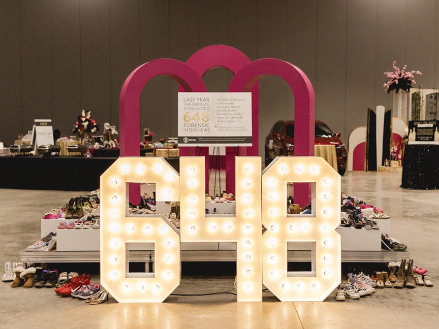 This image represents the 648 children who received services through MRCCAC in 2022. Each pair of shoes symbolizes hope for these children who were able to share their stories and receive the support they needed. Impact